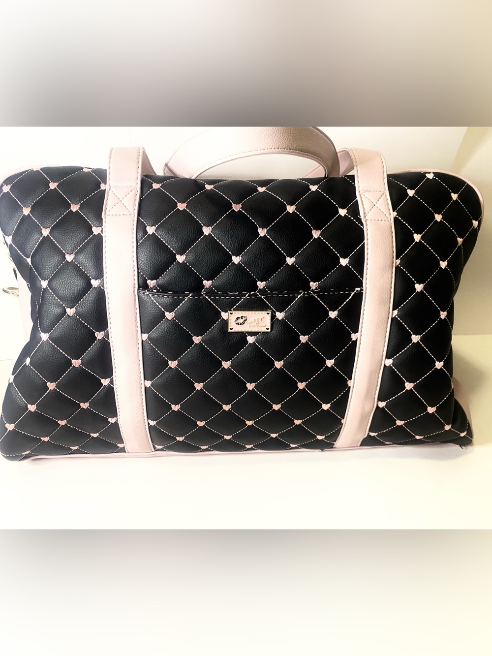 LUV BETSEY by Betsey Johnson quilted bag features a distinctive black and pink